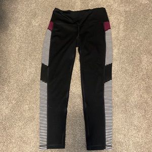 Ideology leggings. Black, maroon and white stripes.